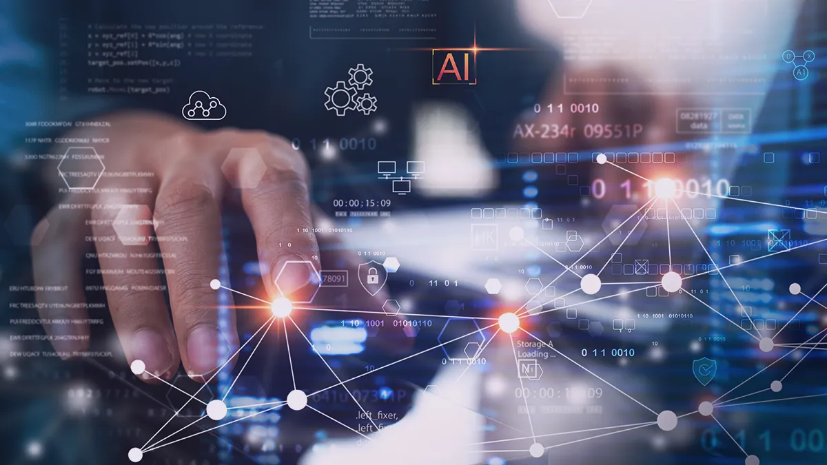 The photo shows a section of a screen displaying a number of different icons and a finger pressing one of the spots on the screen from which lines and dots diverge. From the context, it appears that the man is checking the connections between the data and analyzing the information using a high-tech, high-tech engine. The photo is the cover graphic for an expert article on the Transition Technologies PSC blog and appears as an illustration of a post titled: How can AI Data Discovery help manufacturing companies?