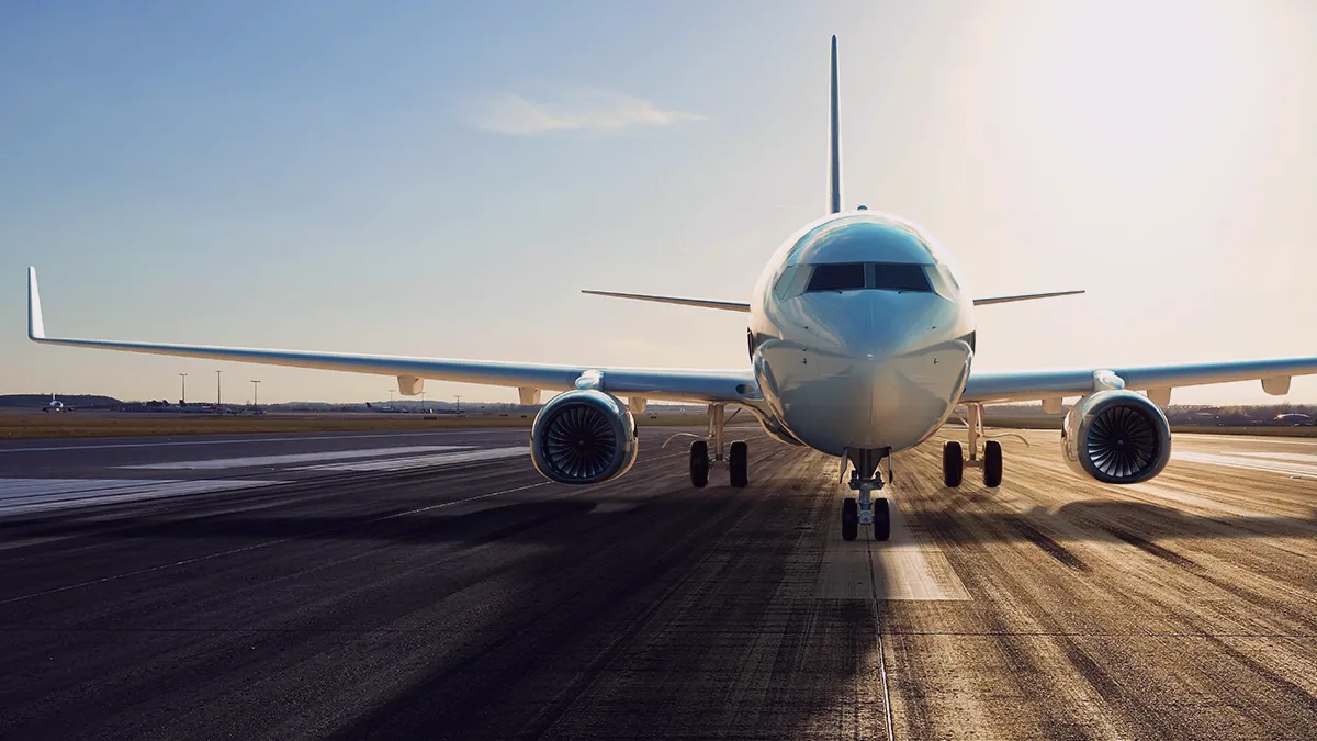 A photo showing an airplane on the runway, this is the highlight photo for a Transition Technologies PSC blog article titled: Lesson Learned Explained: How proper data collection and storage proved crucial in predictive maintenance