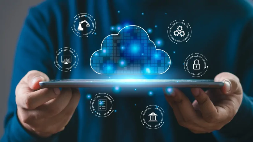 A person holds a tablet displaying a glowing cloud and tech icons, representing cloud computing and data services.