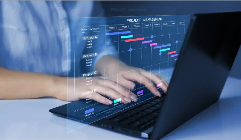 Project management on a laptop with a Gantt chart and task list.